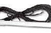 A black bow with long tails on top of it.